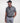 Man wearing the Frenzy athletic golf polo by Ferret, with bold geometric line pattern in multiple directions and lightweight fabric. Golf polo