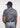 Man wearing the Frenzy athletic golf polo by Ferret, with bold geometric line pattern in multiple directions and lightweight fabric. Golf polo
