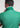 Man on the golf course wearing the Dots Ferret polo, showcasing small white ball pattern on a breathable DryFleX fabric.