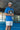 Fer Domínguez wearing a blue Ferret polo and holding a padel racket at SD Padel.
